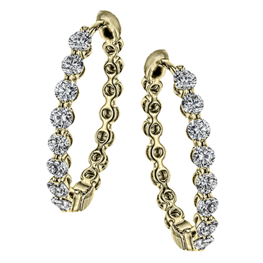 Introducing the Simon G. 18K Yellow Gold Diamond Hoop Earrings, featuring an exquisite pair of earrings adorned with 1.51 ctw of brilliant round white diamonds. Each hoop showcases a series of dazzling diamonds set into the elegant gold band, offering a luxurious and sophisticated design. Displayed against a pristine white background, these earrings epitomize timeless elegance from Simon G.