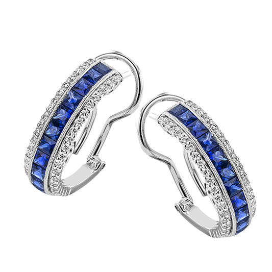 The Simon G. 18K White Gold Hoop Earrings showcase vertical rows of princess-cut sapphires paired with small clear crystals, all set in an elegant hoop design with secure lever-back closures.