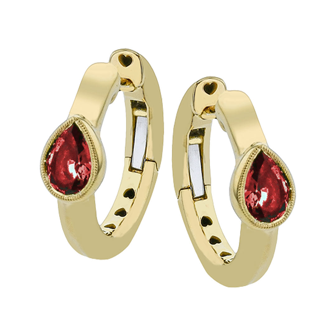 The Simon G. 18K Yellow Gold Diamond and Ruby Hoop Earrings feature elegant hoops with teardrop-shaped pear rubies at the center and refined circular cutouts along the inner side for a sophisticated look.