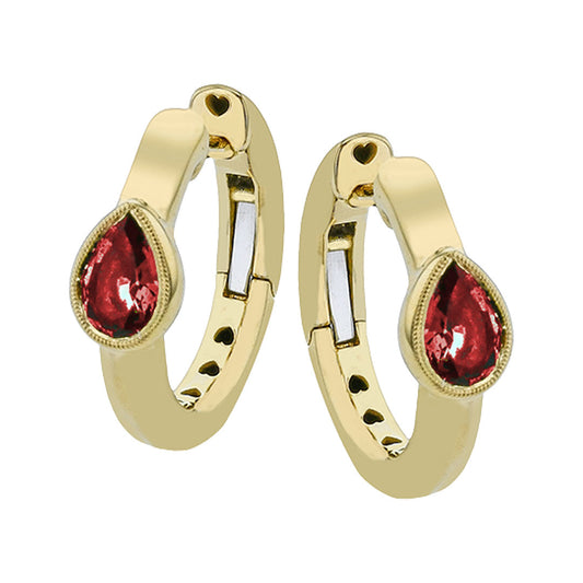 The Simon G. 18K Yellow Gold Diamond and Ruby Hoop Earrings feature elegant hoops with teardrop-shaped pear rubies at the center and refined circular cutouts along the inner side for a sophisticated look.