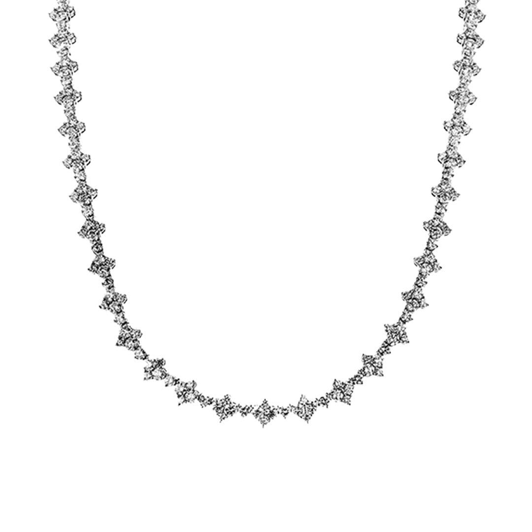 The Simon G. 18K White Gold Diamond Necklace features evenly spaced clusters of round diamonds totaling 8.20 CTW, creating a shimmering pattern along its length. Displayed on a plain white background.