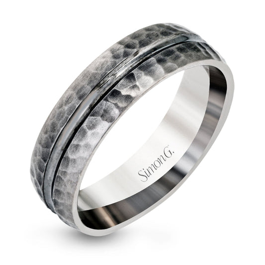 A Simon G 14K White Gold Ring Band featuring a hammered texture and a smooth groove around the middle, with a polished inner band that highlights its elegant design.