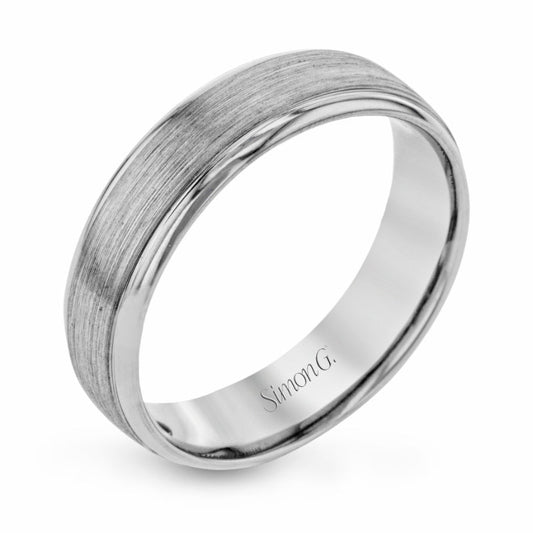 This sophisticated Simon G. 14K white gold men's ring band features a brushed texture with polished edges, elegantly engraved with "Simon G." on the inside, offering a timeless sense of elegance against a simple white backdrop.