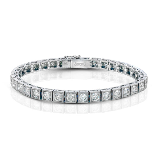 The Simon G. 18K White Gold Diamond Bracelet from Simon G is beautifully showcased on a white background, highlighting its round diamond settings and secure clasp.