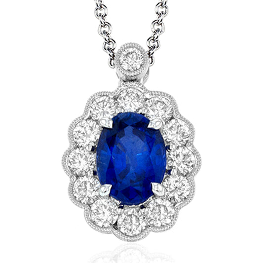 The Simon G. 18K White Gold Diamond and Sapphire Necklace Pendant features an exquisite design with a silver chain and a breathtaking pendant showcasing a large oval blue sapphire center stone, beautifully encircled by dazzling white diamonds in an elegant scalloped pattern.