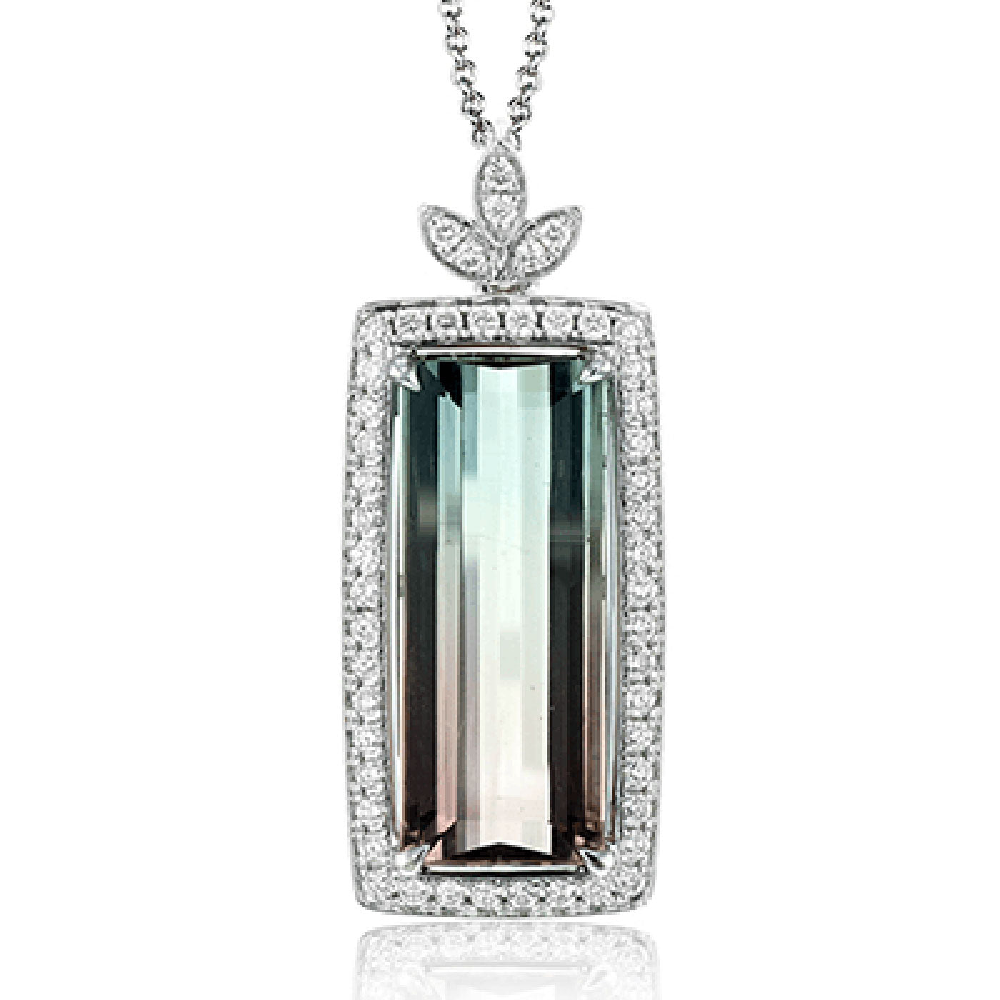 The Simon G. 18K White Gold Tourmaline with Diamond Necklace Pendant features a striking rectangular watermelon tourmaline with a stunning green-to-brown gradient, surrounded by small white diamonds. At the top, three leaf-shaped diamonds add an elegant decorative touch to the pendant, which hangs gracefully from a silver chain.