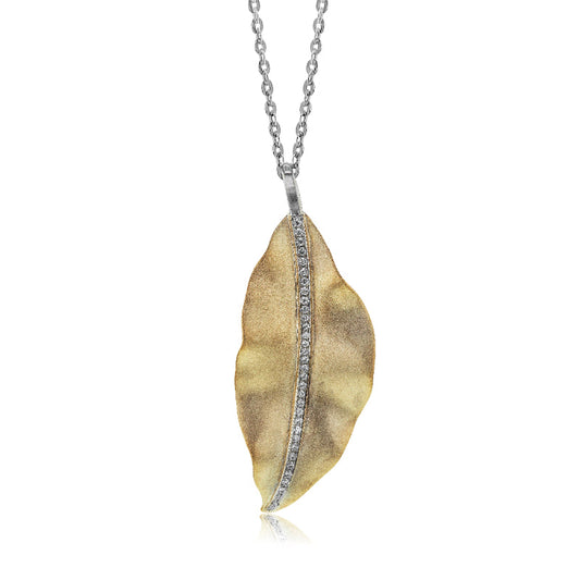 The Simon G. 18K White and Yellow Gold Diamond Necklace Pendant boasts a leaf-shaped design with a textured gold finish, featuring a central line of small embedded gemstones. This exquisite two-tone piece hangs gracefully from a silver chain, set against a white backdrop.