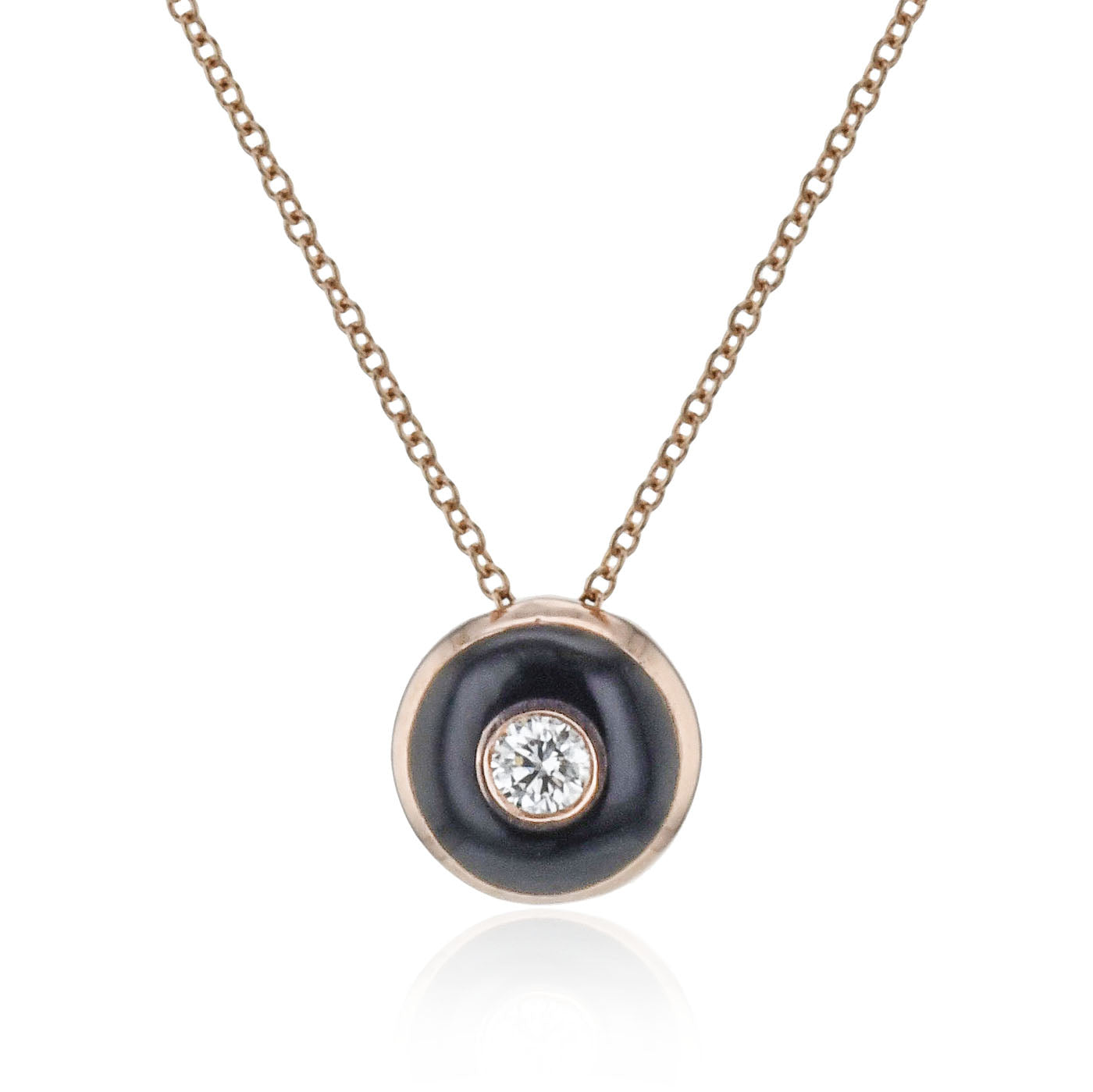 The Simon G 18K White Gold Diamond Necklace Pendant from Simon G features a sleek gold chain and highlights a black circular enamel pendant, adorned with an elegant central diamond.