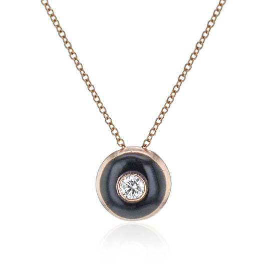 The Simon G 18K White Gold Diamond Necklace Pendant from Simon G features a sleek gold chain and highlights a black circular enamel pendant, adorned with an elegant central diamond.