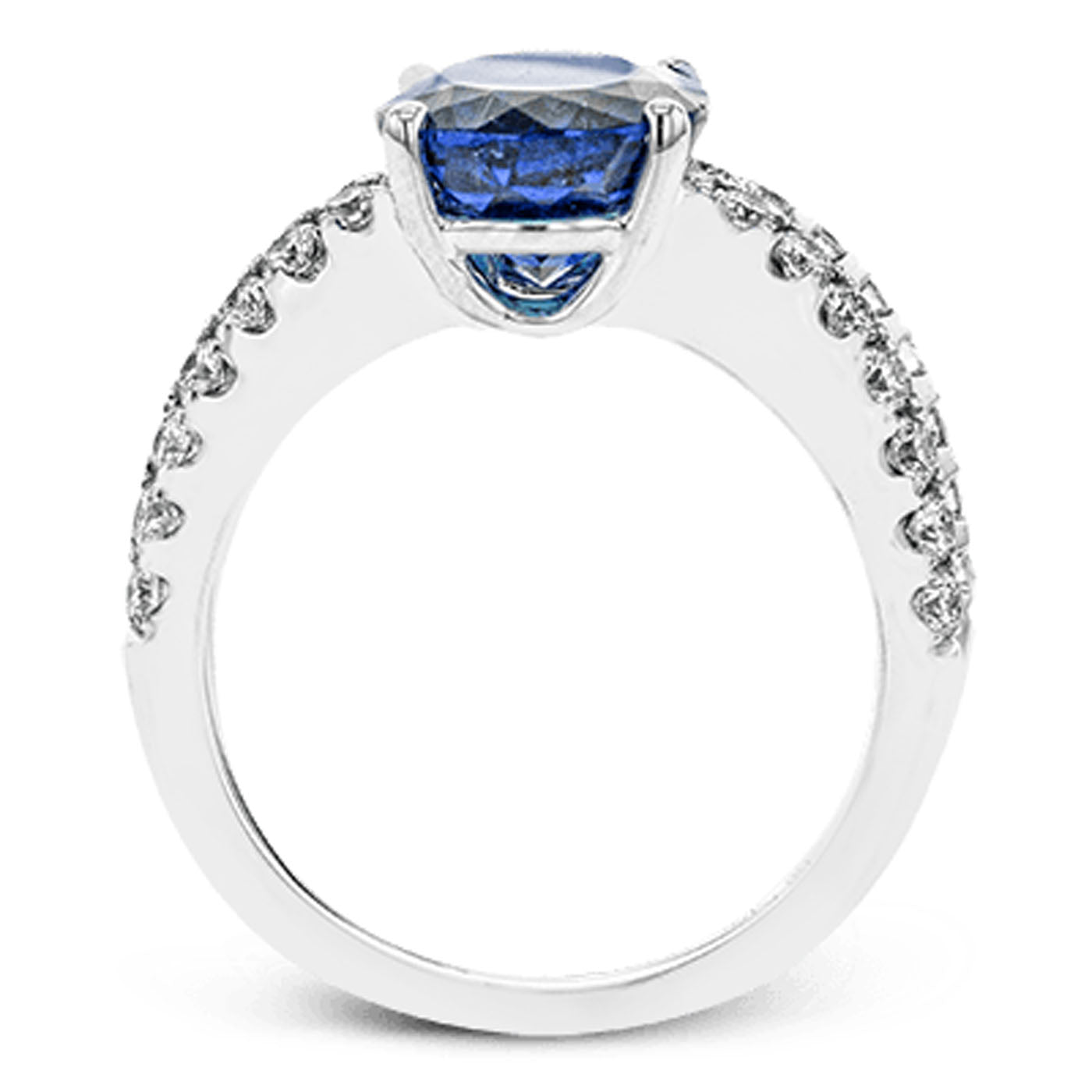 The Simon G. 18K White Gold Oval Tanzanite with Diamond and Sapphire Fashion Ring features a prominent blue tanzanite gemstone at its center, complemented by small white diamonds adorning the band.