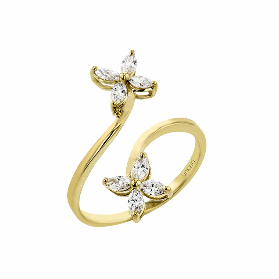 The Simon G. 18K Yellow Gold Marquise Diamond Fashion Ring features an open band design adorned with two flower-like clusters. Each cluster shimmers with five marquise-cut diamonds arranged as petals, creating an elegant fashion accessory.