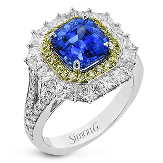 A breathtaking Simon G. 18K White and Yellow Gold Fashion Ring showcases a prominent rectangular blue sapphire centerpiece, elegantly surrounded by a halo of small yellow stones and shimmering white diamonds. The band is adorned with additional dazzling diamonds, capturing the exquisite elegance synonymous with Simon G. design.