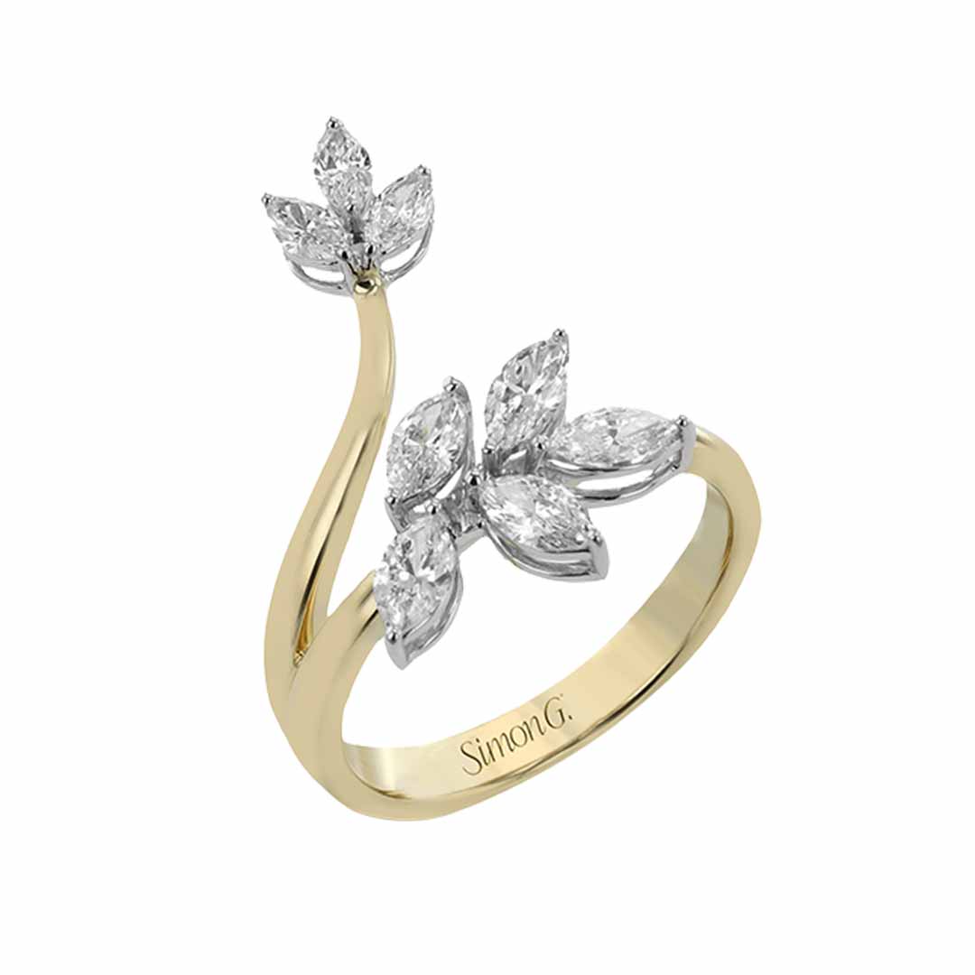 The Simon G. 18K Yellow Gold Marquise Diamond Fashion Ring showcases a distinctive open design adorned with multiple marquise diamonds arranged in a floral motif, and the band is artistically engraved with "Simon G.
