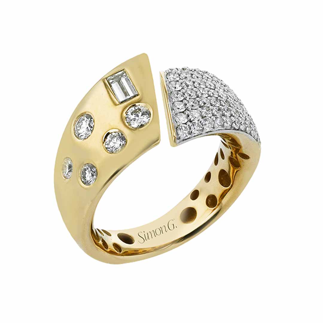 The Simon G. 18K Yellow Gold with Various Diamond Shapes Fashion Ring features a distinctive curved design. One side is adorned with five circular diamond settings, while the opposite side showcases a dense array of smaller diamonds, forming a contrasting pattern. The brand name "Simon G" is elegantly engraved inside the ring.