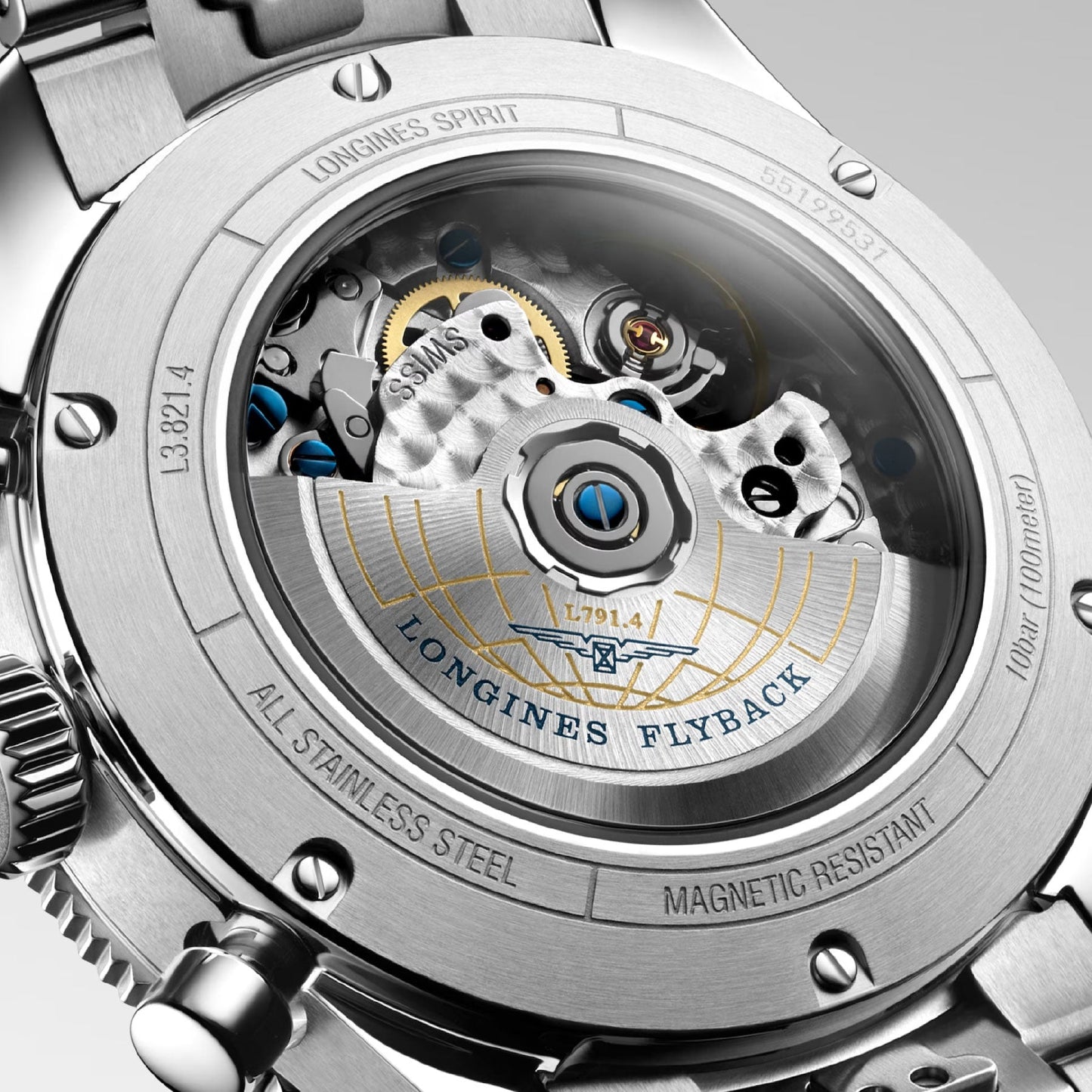 Close-up of the Longines Spirit Flyback Automatic Chronograph 42mm Watch's back, highlighting the intricate mechanical movement through a transparent case. The winged hourglass emblem showcases features like water resistance, stainless steel construction, and the flyback chronograph function—a tribute to its legendary pioneers.