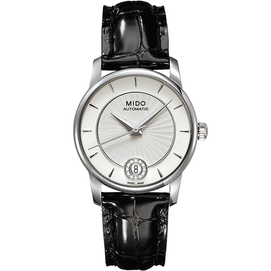 The MIDO Baroncelli II Lady Diamonds Automatic 33mm Watch features a textured white dial, slim silver markers, date at 6 o’clock, automatic movement, and a glossy black leather strap.