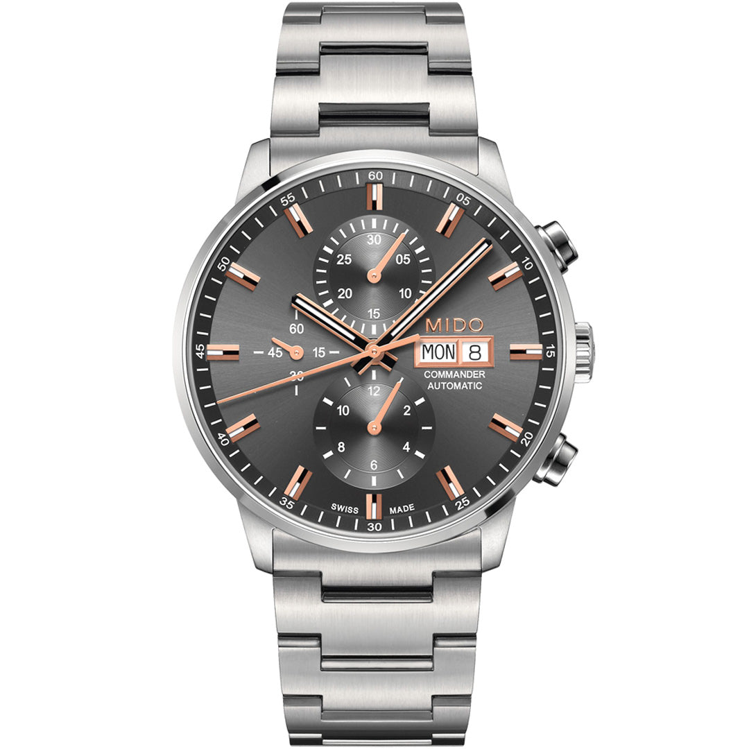 The MIDO Commander Chronograph Automatic 42.5mm Watch features a sunray satin-finished gray dial, rose gold-tone hands and markers, three subdials, and a day-date window at 3 o’clock.
