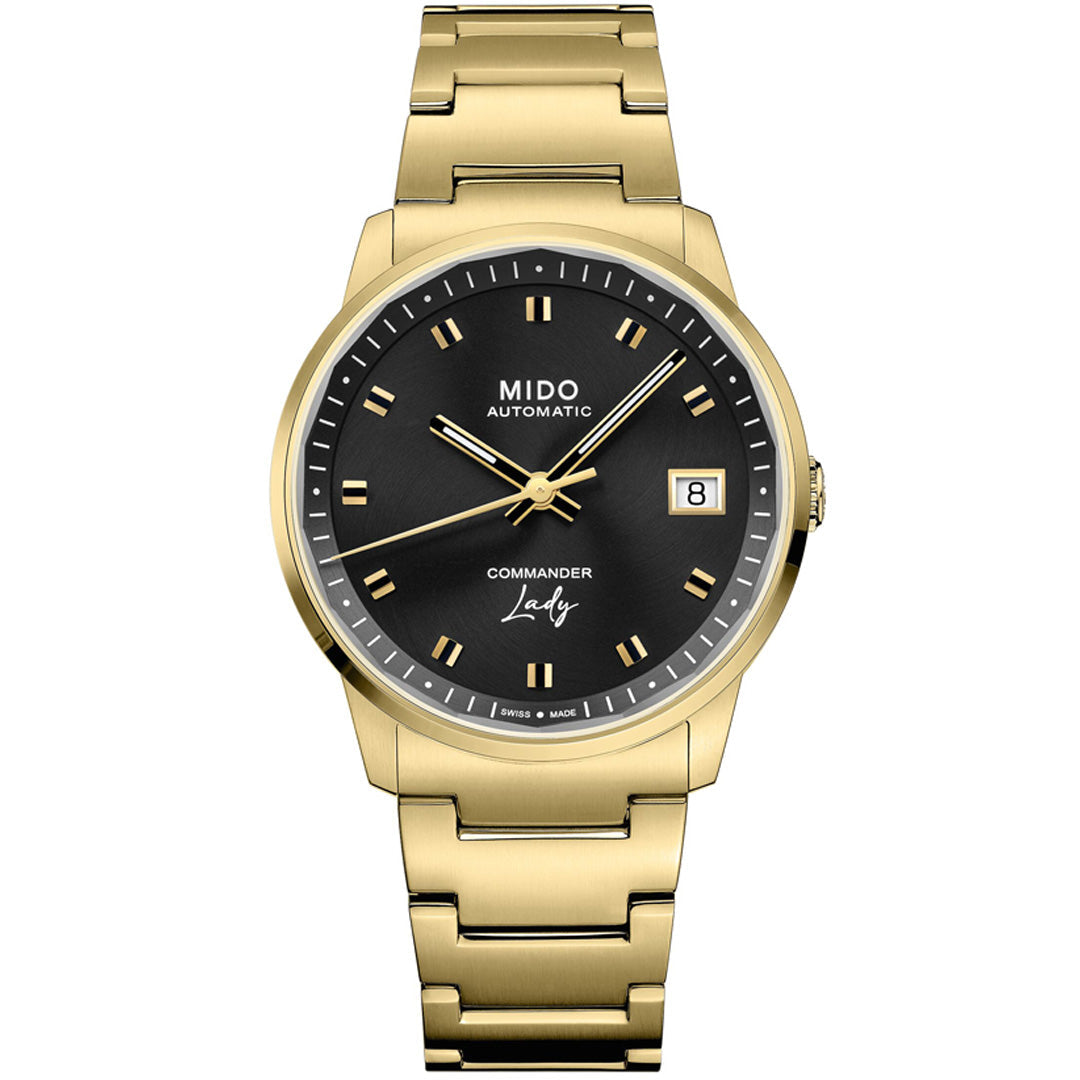 The MIDO Commander Lady Automatic 35mm Watch is a gold Swiss luxury women’s watch with a black dial, gold hour markers and hands, date display at 3 o'clock, and a matching gold metal bracelet.