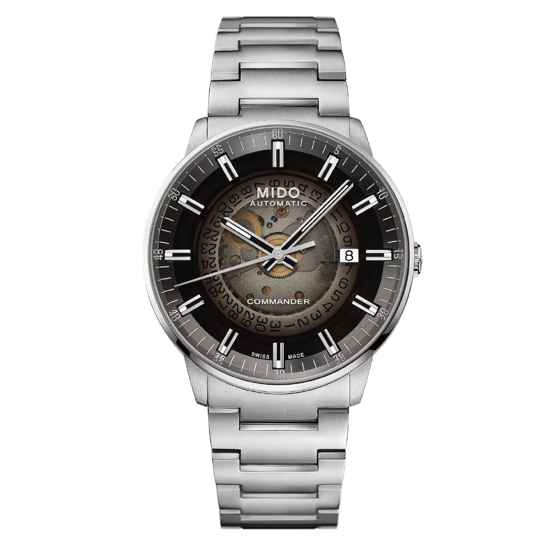 The MIDO Commander Gradient Automatic 40mm features a Caliber 80 movement, round dial with date at 3 o’clock, textured center, silver bracelet, and white hour markers that enhance its black and gray refined design.