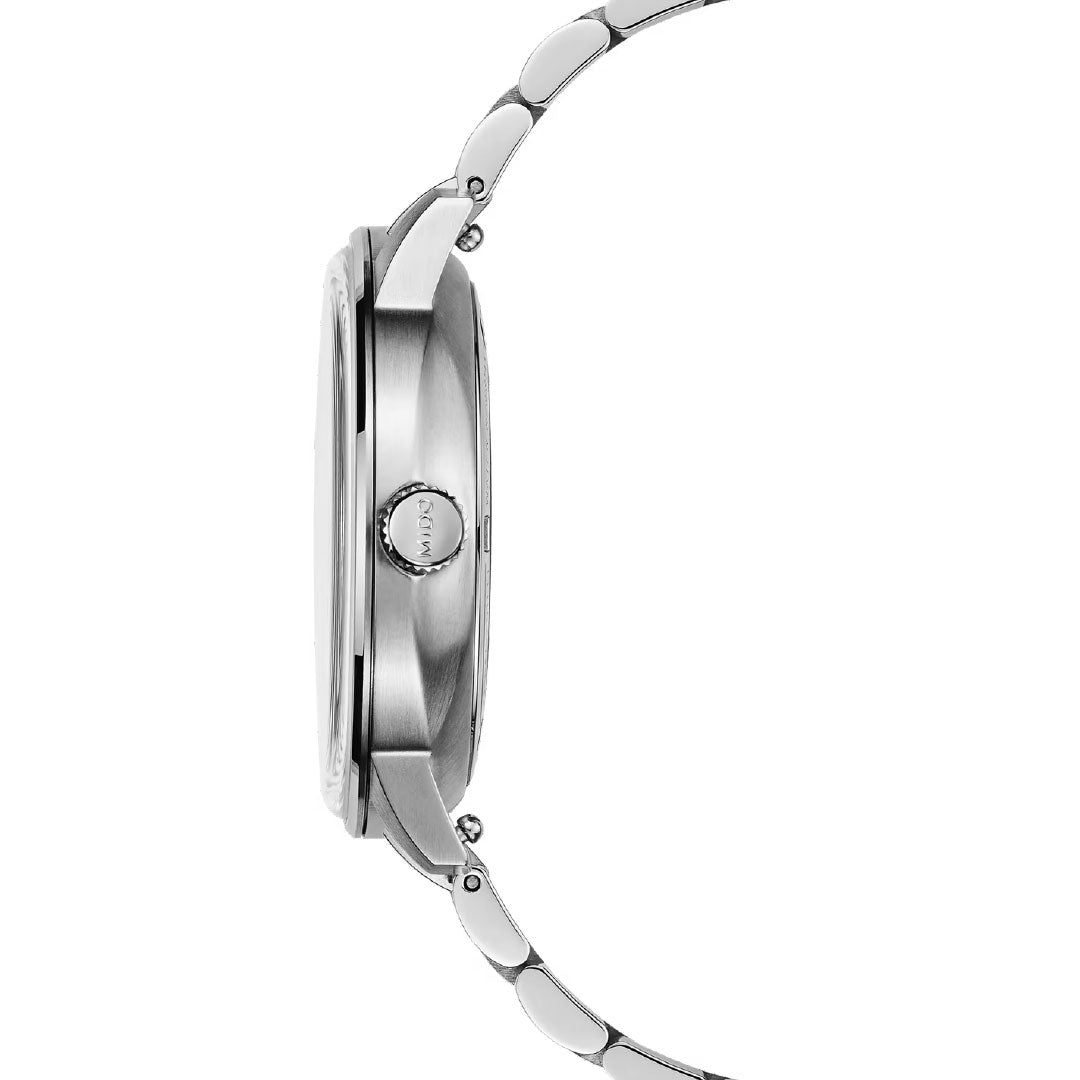 Side view of the slim MIDO Commander Datoday Automatic 40mm Watch, featuring a stainless-steel band, round crown, and elegant day-date display by MIDO, emphasizing its thin profile and smooth finish.