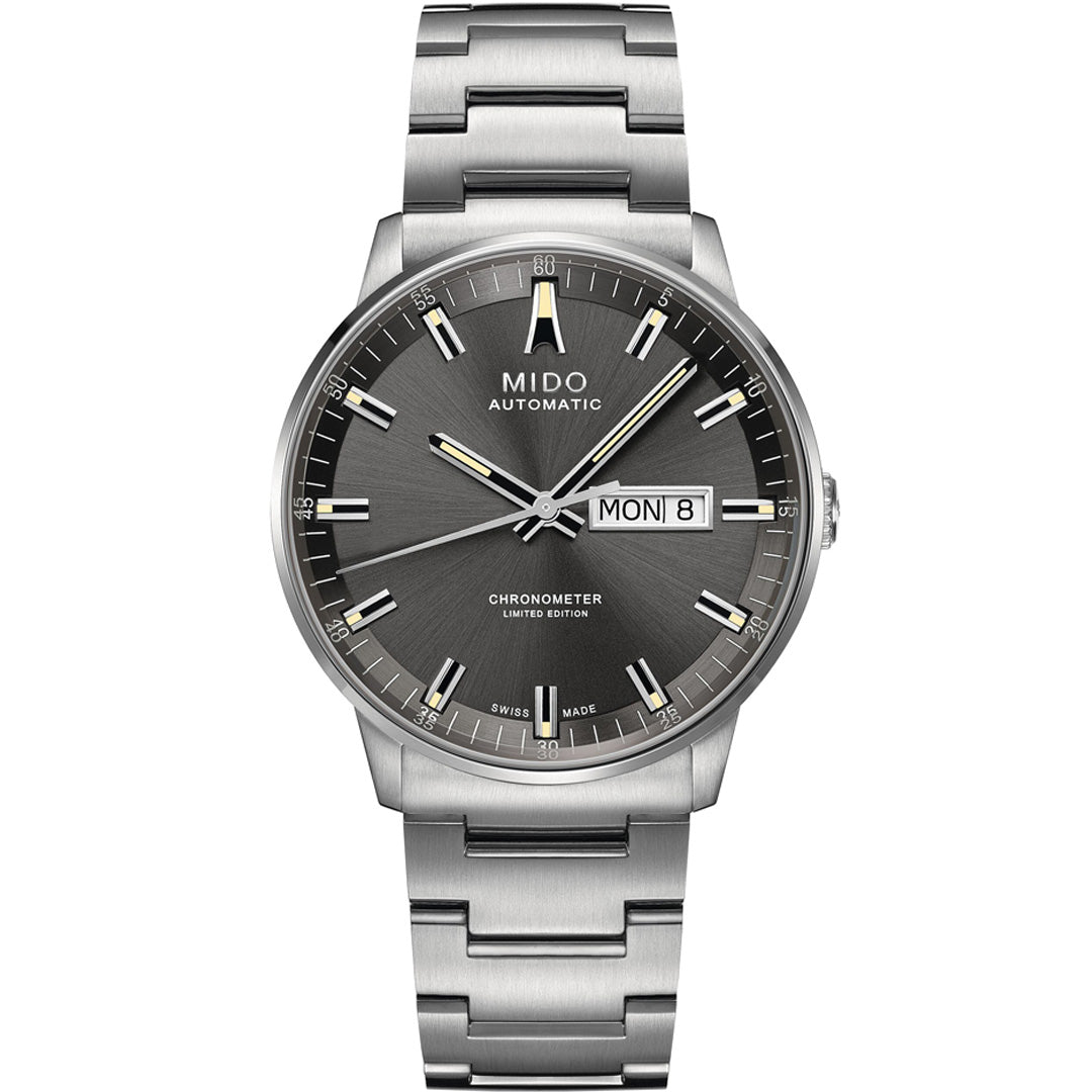 The MIDO Commander 20th Anniversary Limited Edition Automatic 40mm watch showcases architectural inspiration, a sunburst gray dial with silver markers and hands, day/date at 3 o’clock, and a stainless steel bracelet.