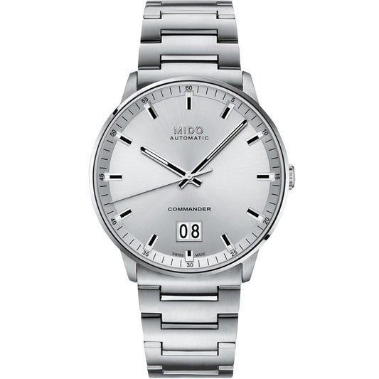 The MIDO Commander Big Date Automatic 42mm Watch features a metal band, minimalist dial, silver hour markers and hands, and a large date window above 6 o’clock.