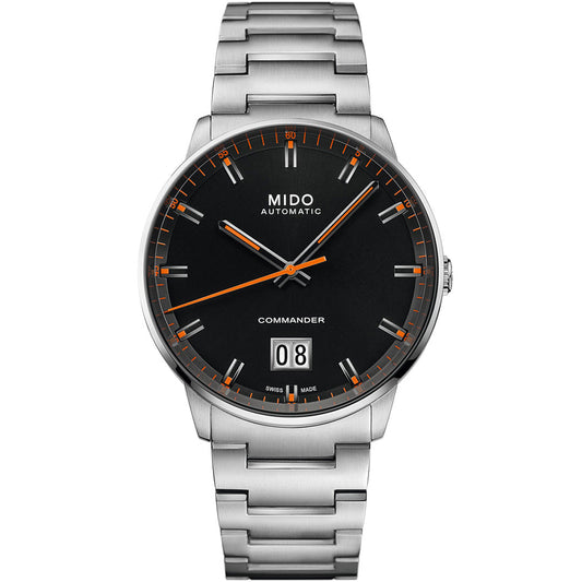 The MIDO Commander Big Date Automatic 42mm Watch features a stainless steel case, black dial with orange accents, silver markers, Caliber 80 movement, date at 6 o’clock, and a metal link bracelet. “MIDO AUTOMATIC” is labeled on the face.