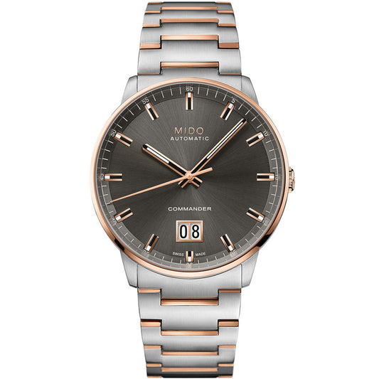 The MIDO Commander Big Date Automatic 42mm Watch features a silver and rose gold two-tone bracelet, dark gray sunburst dial, rose gold markers and hands, Caliber 80 movement, and a big date window at 6 o’clock.