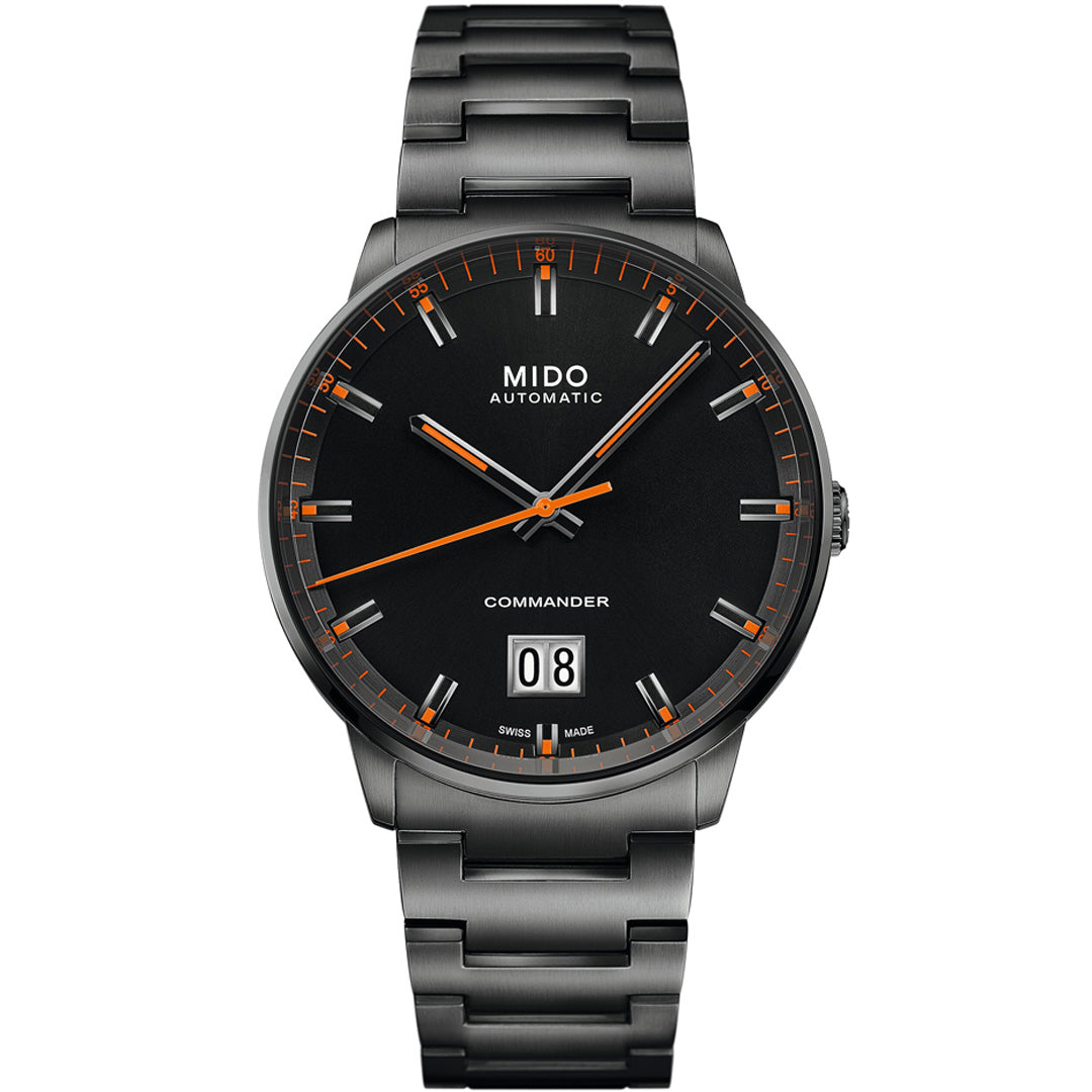 The MIDO Commander Big Date Automatic 42mm Watch features black stainless steel, orange accents, a black dial with silver markers, a large date at 6 o'clock, and is powered by the reliable Caliber 80 movement.