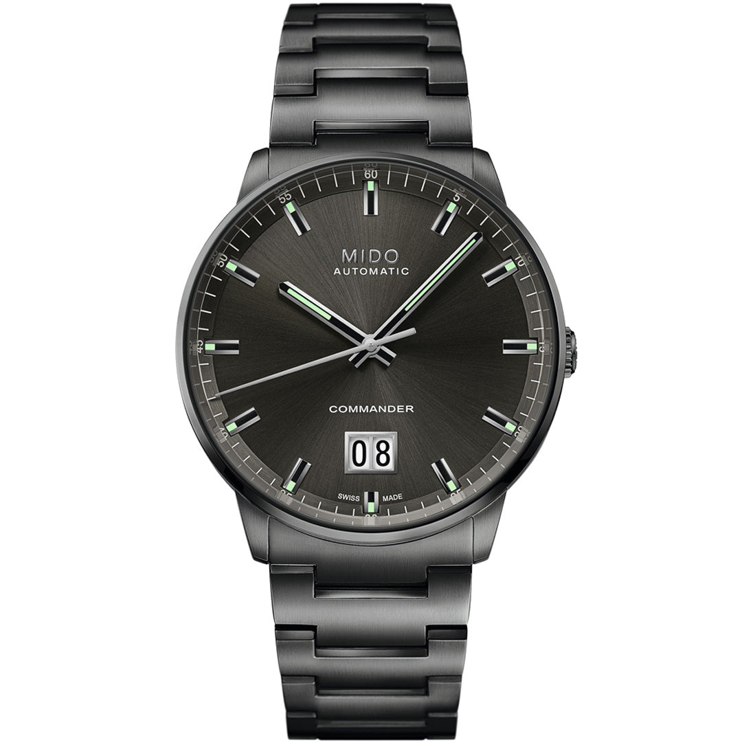 The MIDO Commander Big Date Automatic 42mm Watch features a dark metallic bracelet, black sunburst dial, silver markers and hands, large date at 6 o'clock, and is powered by the precise Caliber 80 movement.