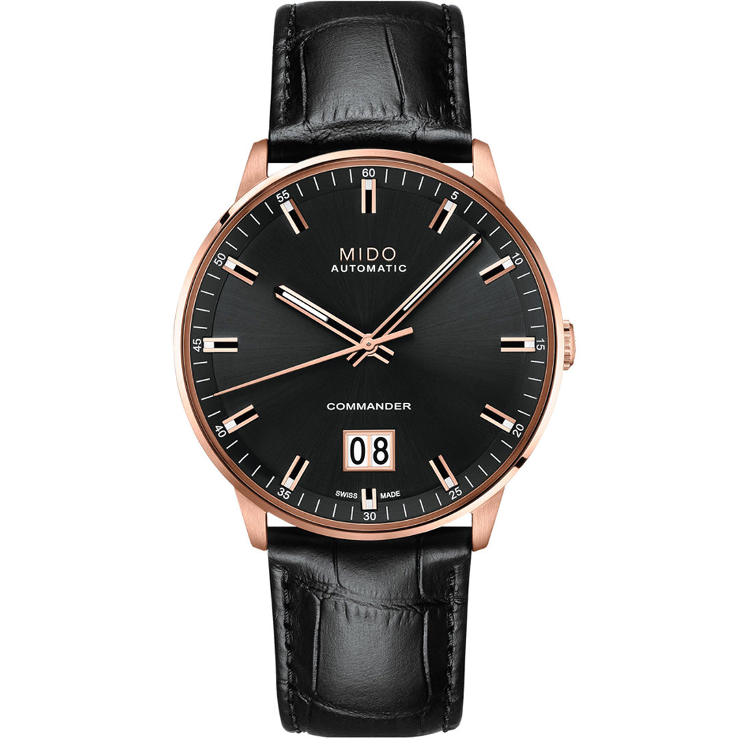The MIDO Commander Big Date Automatic 42mm Watch features a Caliber 80 movement, black leather strap, black dial, rose gold case, white date display at 6 o'clock, and silver hour markers with "COMMANDER" above the date.
