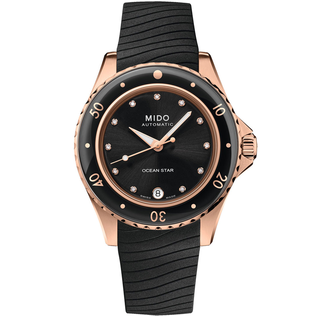 The MIDO Ocean Star 36.5 Automatic, a sixties-inspired diver's watch, features a black dial with diamond indexes, date at 6 o’clock, rose gold case, black bezel, textured black rubber strap, and Swiss automatic movement.