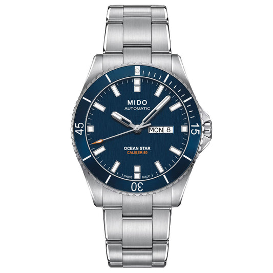 The MIDO Ocean Star 200 Automatic 42.5mm Watch features a blue dial, white hour markers, luminous hands, date and day display, unidirectional bezel, and water resistant stainless steel construction.