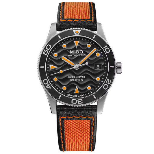 The MIDO Ocean Star 200 Automatic 42.5mm watch features a black wavy-pattern dial with orange accents, date at 3 o’clock, automatic movement, water resistance, and a black and orange fabric strap.