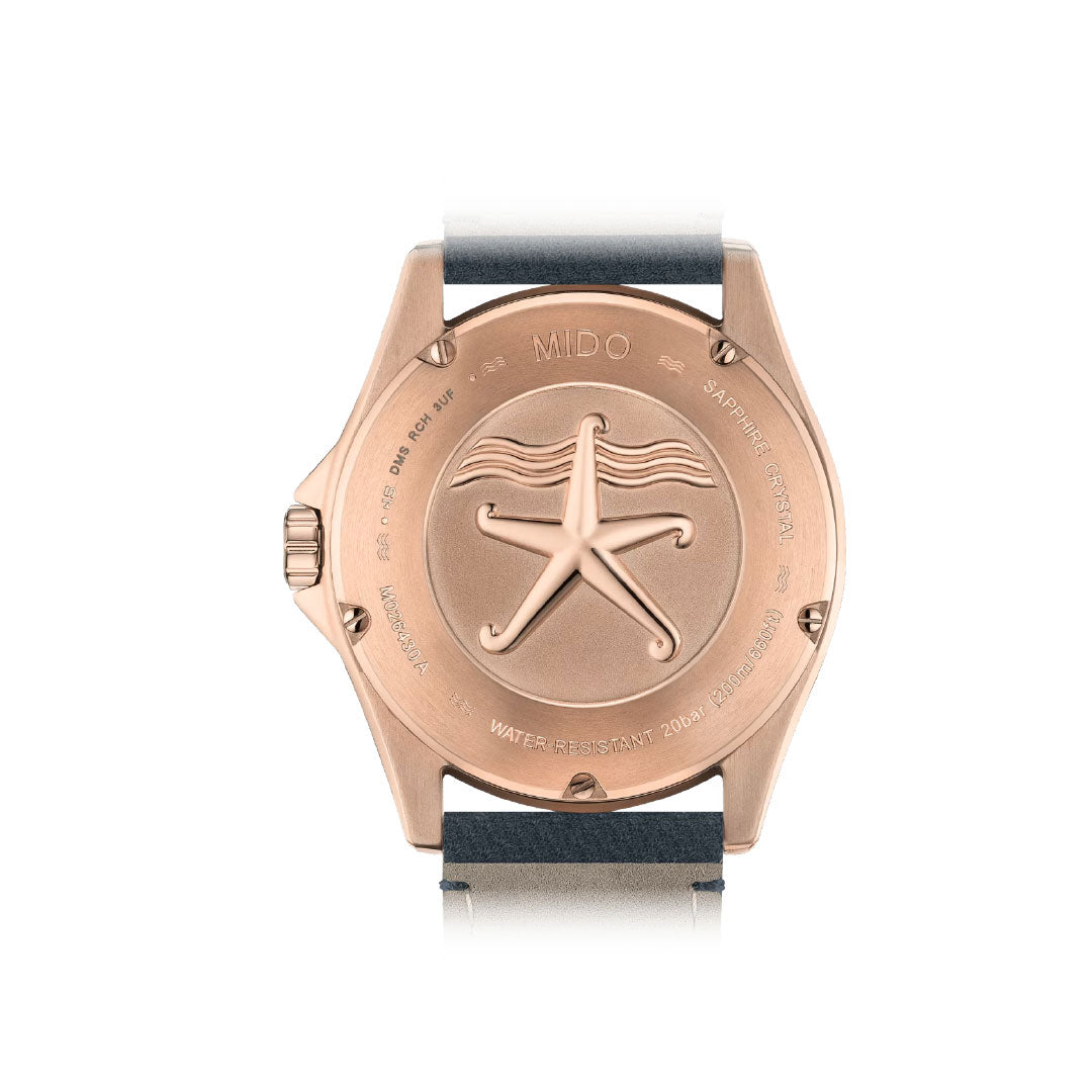 Close-up of the caseback on the MIDO Ocean Star 200 Automatic 42.5mm Watch, showing an engraved starfish, water resistance markings along the edge, and a black and gray strap from MIDO.