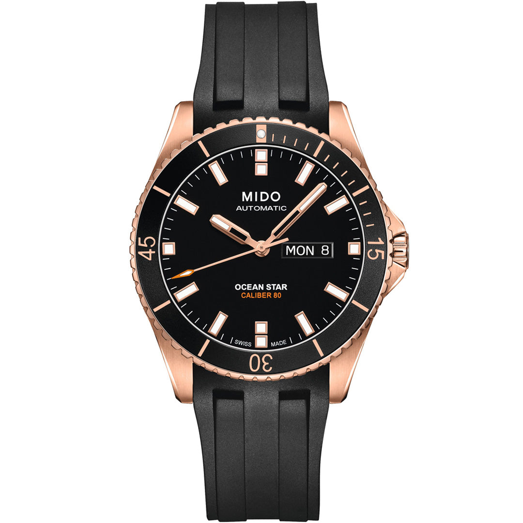 The MIDO Ocean Star 200 Automatic 42.5mm Watch features a black dial, rose gold case, black rubber strap, day-date at 3 o’clock, luminous hands and markers, and is water resistant.