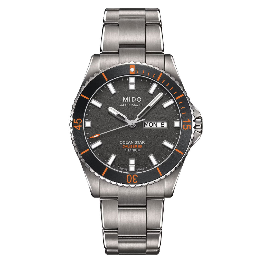 The MIDO Ocean Star 200 Automatic 42.5mm watch features a titanium case, automatic movement, gray dial with orange accents, silver markers, day/date display at 3 o'clock, metal link band, and is water resistant.