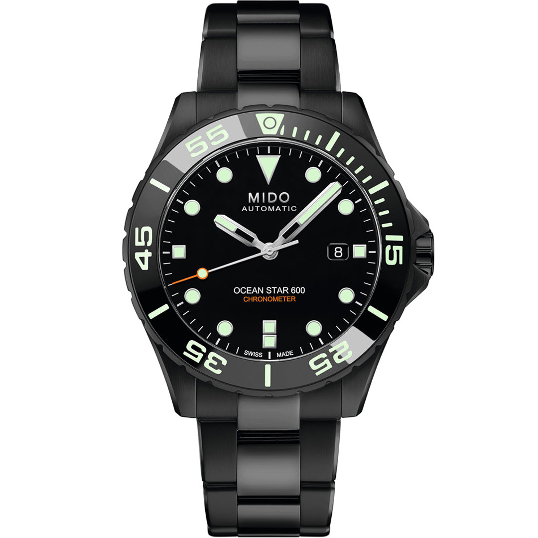 The MIDO Ocean Star Diver 600 Chronometer Automatic 43.5mm Watch features a round black dial, luminous markers and hands, date window at 3 o’clock, black metal bracelet, white-accented bezel, and COSC-certified chronometer precision.