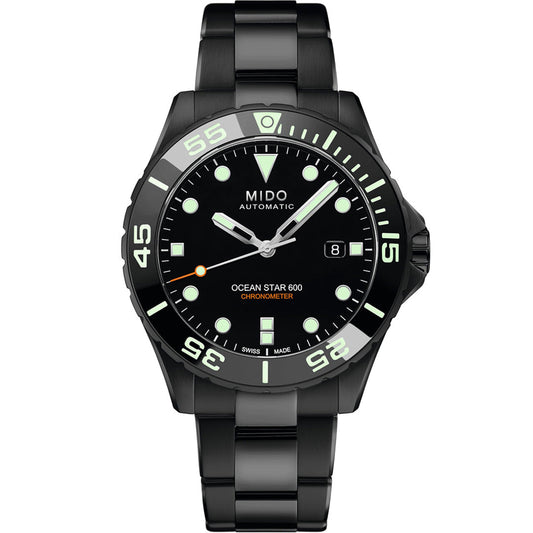 The MIDO Ocean Star Diver 600 Chronometer Automatic 43.5mm Watch features a round black dial, luminous markers and hands, date window at 3 o’clock, black metal bracelet, white-accented bezel, and COSC-certified chronometer precision.