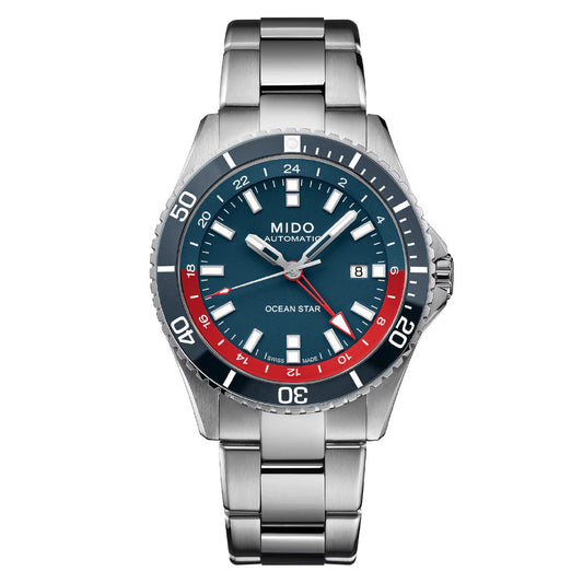 The MIDO Ocean Star GMT Automatic 44mm Watch features a stainless steel case, blue and red bezel, blue dial with white indices, date at 3 o’clock, and silver bracelet—an elegant Swiss timepiece for Ocean Star enthusiasts.