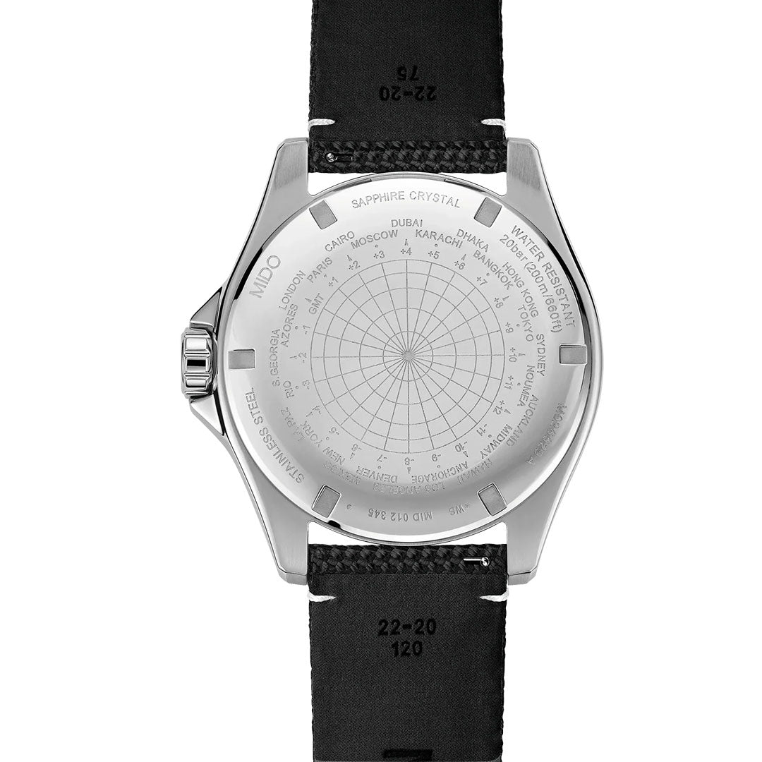 The caseback of the MIDO Ocean Star GMT Automatic 44mm Watch displays an intricate world time zone chart engraved with city names and latitudes, elegantly complemented by a black leather strap. This sophisticated MIDO timepiece is also equipped with a refined GMT function, seamlessly blending practicality and style.