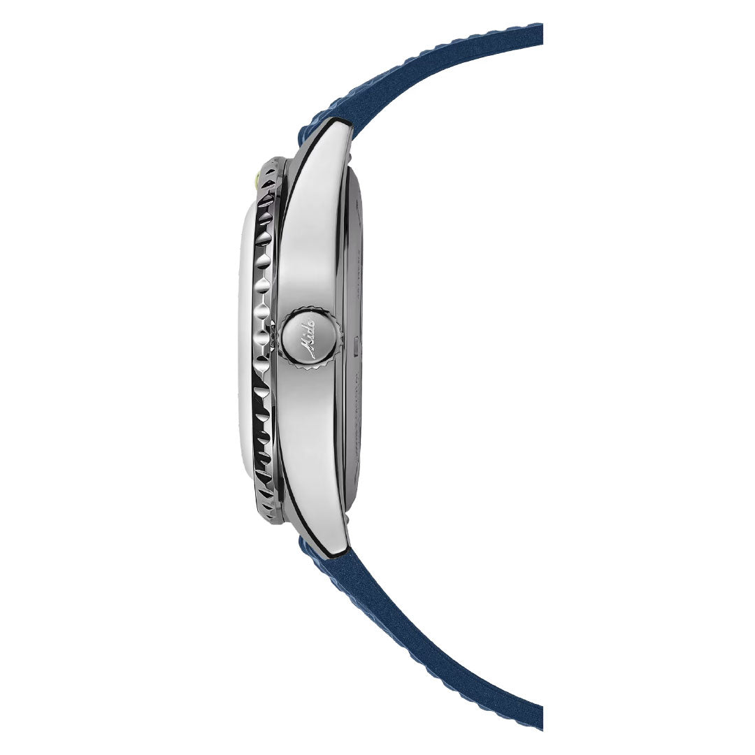 A side view of the MIDO Ocean Star Decompression World Timer Automatic 40.5mm Watch, featuring a silver case, ridged bezel, round logo-engraved crown, and blue leather strap; the watch face is not visible from this angle.