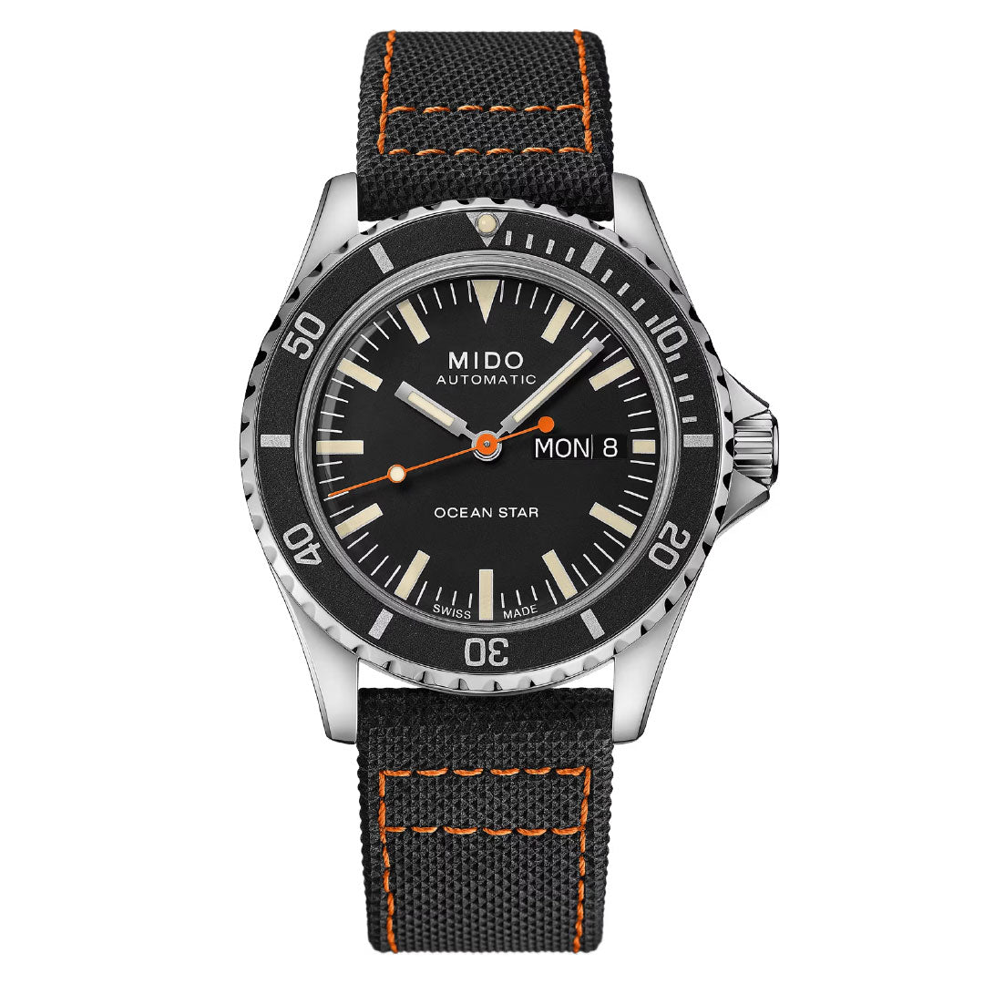 The MIDO Ocean Star Tribute Automatic 40.5mm Watch features a black dial, silver bezel, orange accents, Caliber 80 movement, day/date display, silver markers, and a black fabric strap with bold orange stitching.