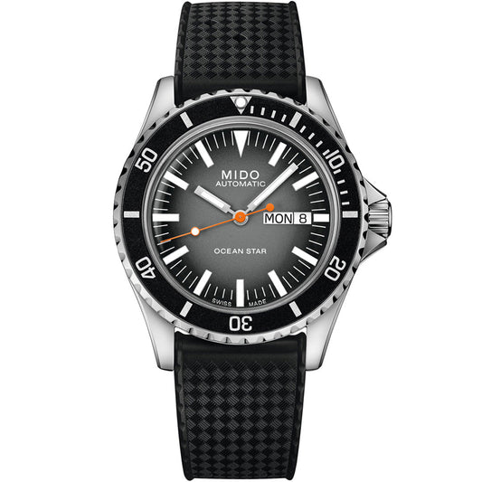 The MIDO Ocean Star Tribute Gradient Automatic 40.5mm Watch features a black textured strap, black bezel, gradient gray dial, day/date display, and orange-accented hands—an elegant Swiss diving timepiece by MIDO.