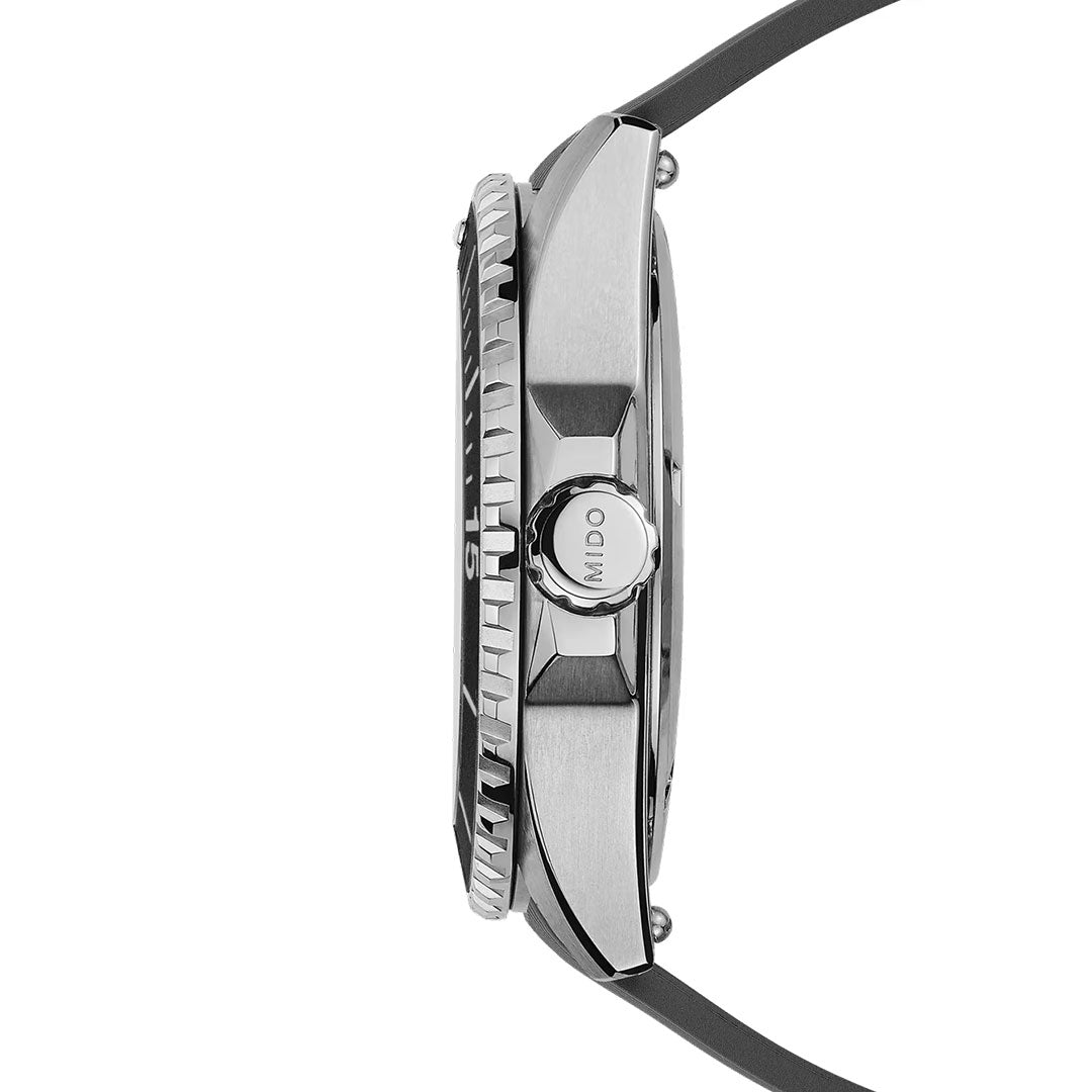 Side view of the MIDO Ocean Star 200 Automatic 41mm Watch featuring a silver brushed metal case, textured bezel, engraved "MIDO" crown, black strap, and water-resistant design.