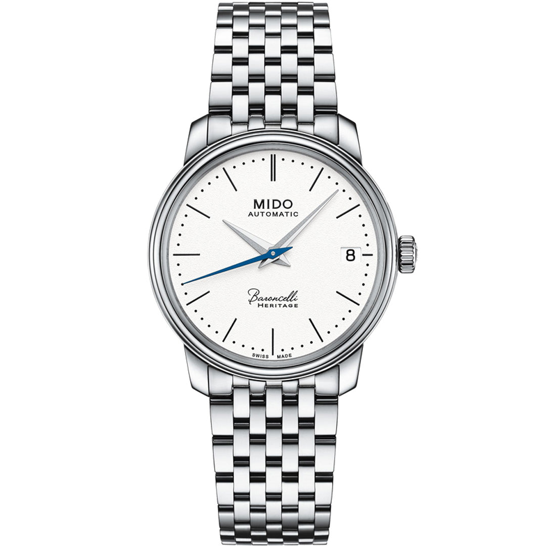The MIDO Baroncelli III Heritage Lady Automatic 33mm Watch features a silver case, automatic movement, white dial with silver markers and hands, blue second hand, date at 3 o’clock, and a silver link bracelet. Dial displays "Mido Automatic" and "Swiss Made.