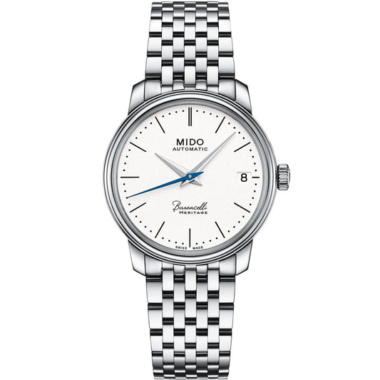 The MIDO Baroncelli III Heritage Lady Automatic 33mm Watch features a silver case, automatic movement, white dial with silver markers and hands, blue second hand, date at 3 o’clock, and a silver link bracelet. Dial displays "Mido Automatic" and "Swiss Made.