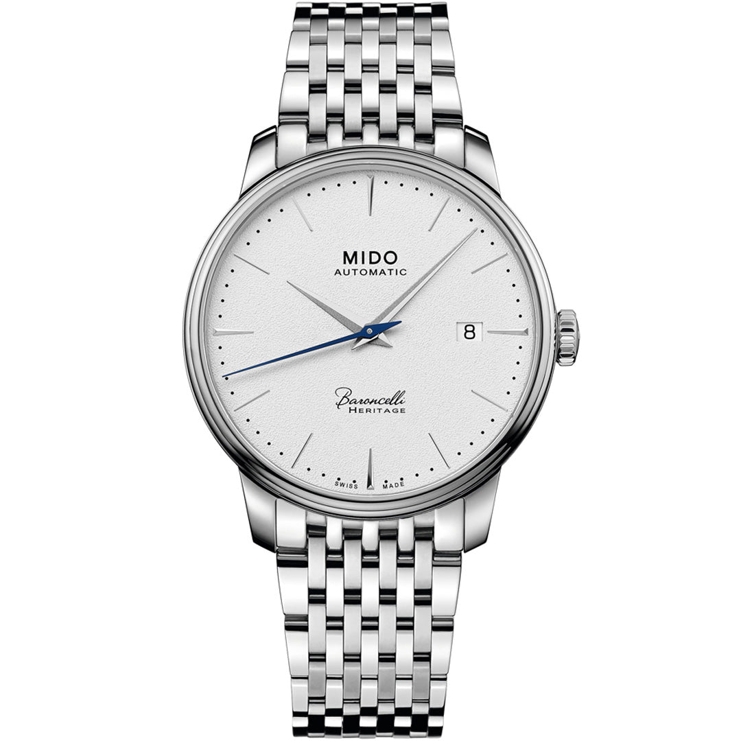 The MIDO Baroncelli Heritage Automatic 39mm Watch features a silver case, white dial, black hour markers, date window at 3 o’clock, three hands, and a stainless steel bracelet—showcasing MIDO’s precision Swiss automatic movement.