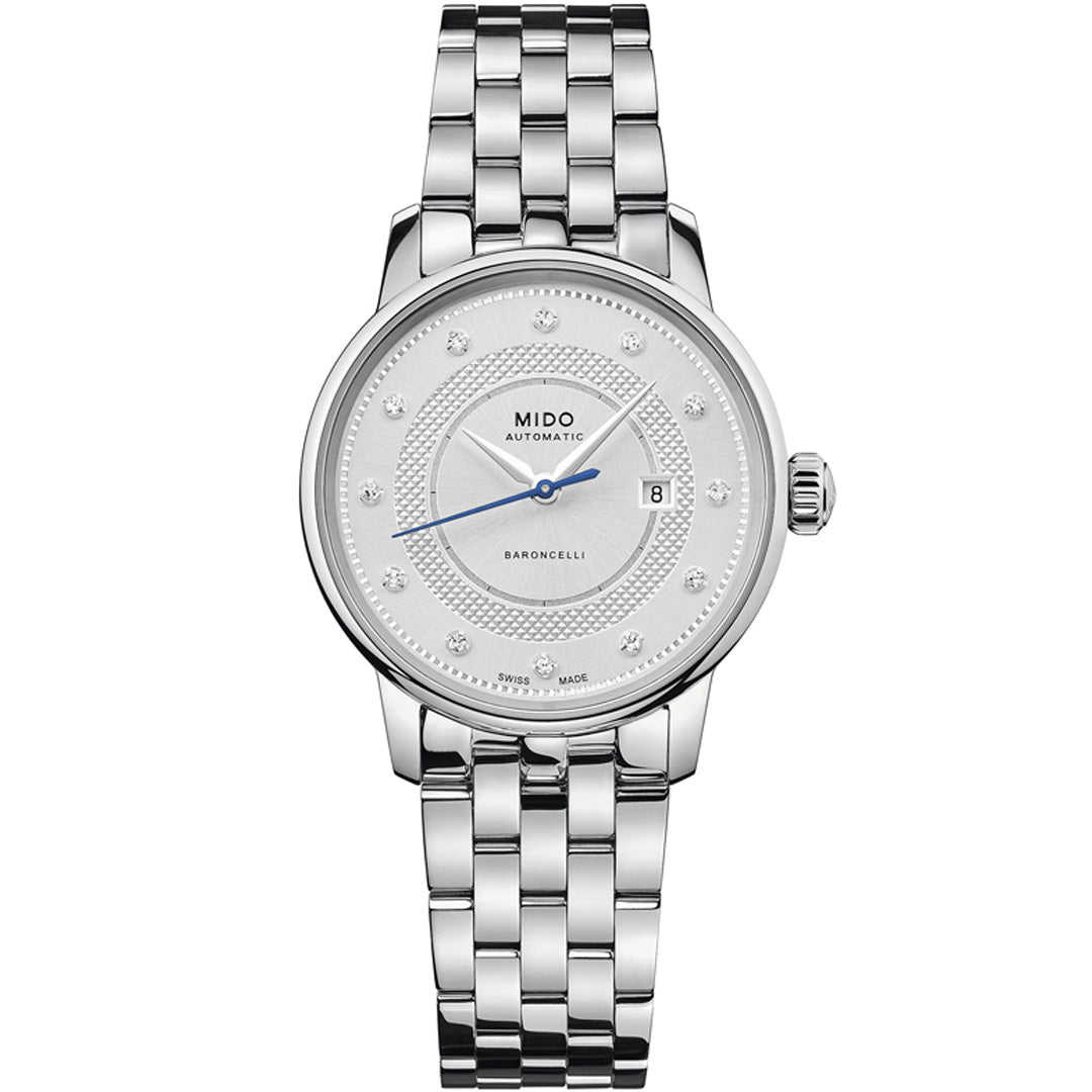 The MIDO Baroncelli II Signature Lady Automatic 30mm Watch features a stainless steel bracelet, white dial with blue hands, diamond hour markers, date at 3 o’clock, and “MIDO AUTOMATIC” on the face.