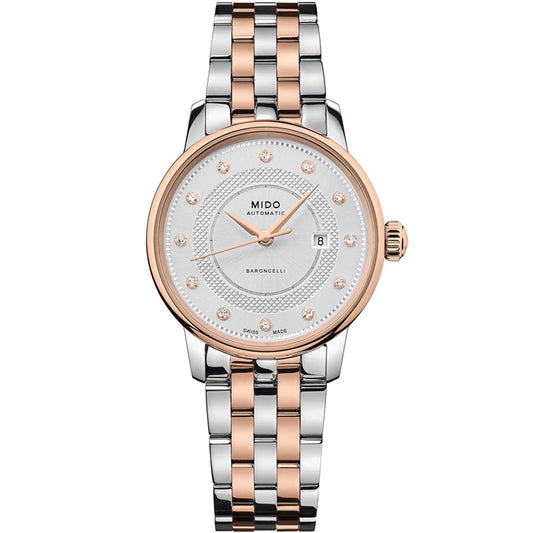 The MIDO Baroncelli II Signature Lady Automatic 30mm Watch features a silver and rose gold two-tone band, round silver dial with crystal markers, date window at 3 o’clock, and precise Nivachron balance-spring for lasting elegance.